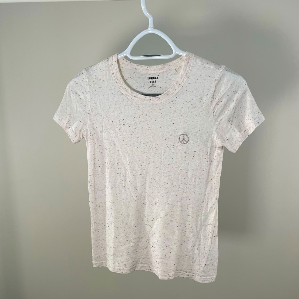 Cream t shirt with a colourful salt and pepper design from Aritzia (Sunday Best)